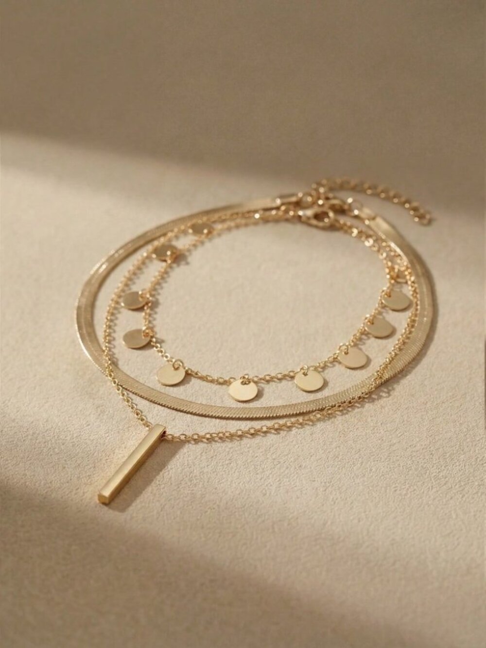 Gold 3 Piece Necklace with Bar Pendant and Disc Charms